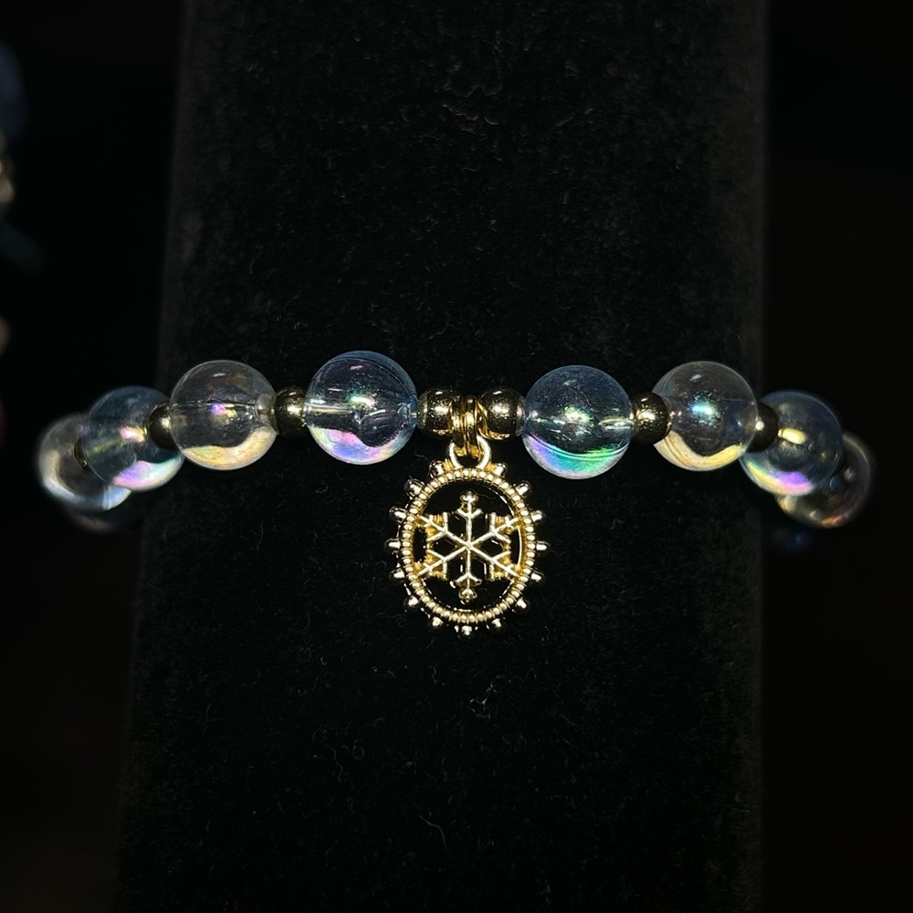 Elegant Gold and Iridescent Blue and White Bead Bracelet with Snowflake Charm